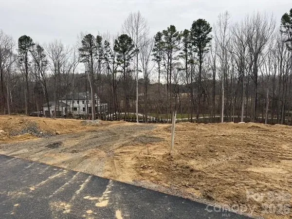 a swimming pool with outdoor seating and yard