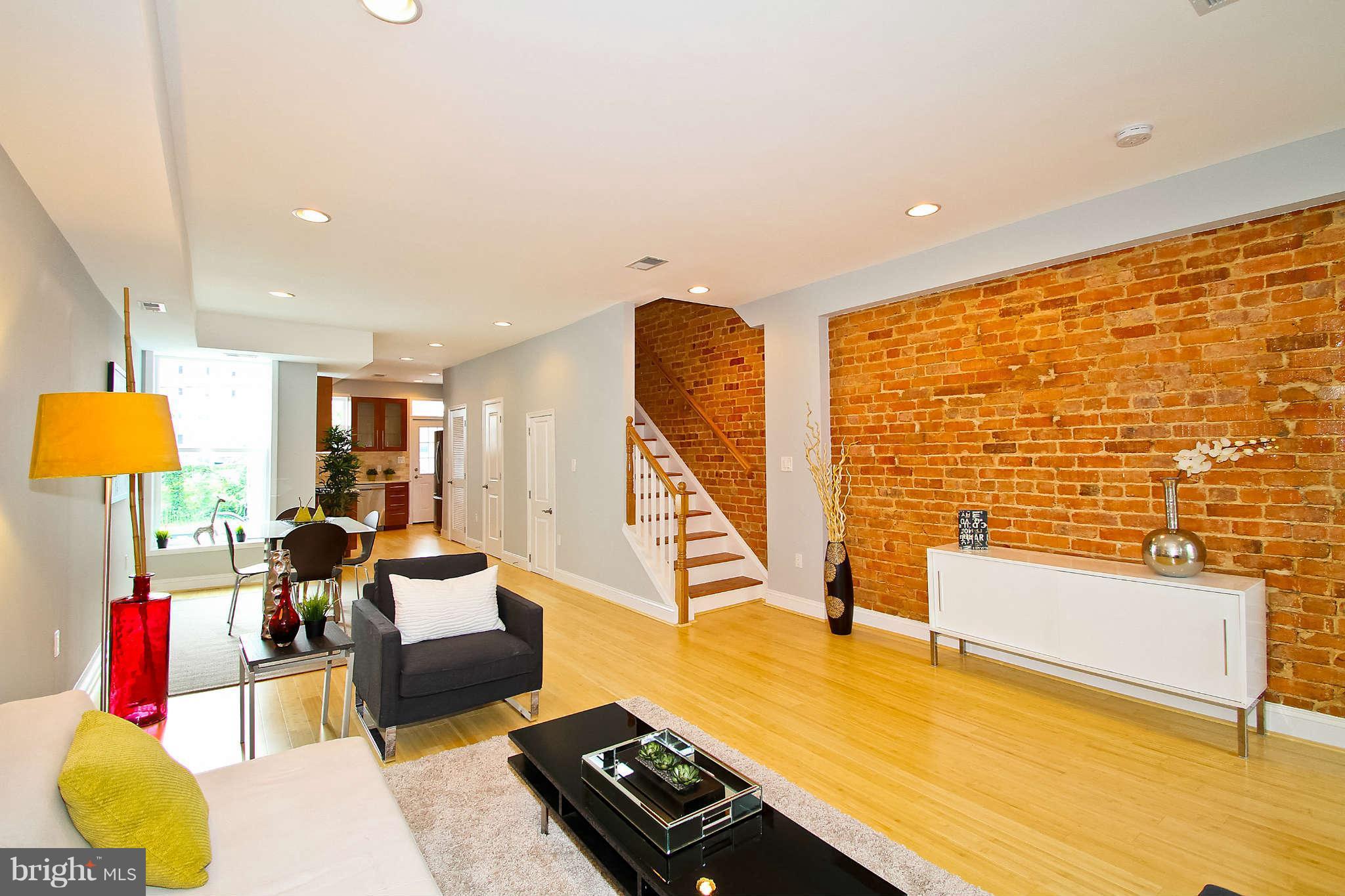 604 Columbia Road Northwest Washington, DC 20001 - Photo 1 of 25 a living room with furniture and a flat screen tv