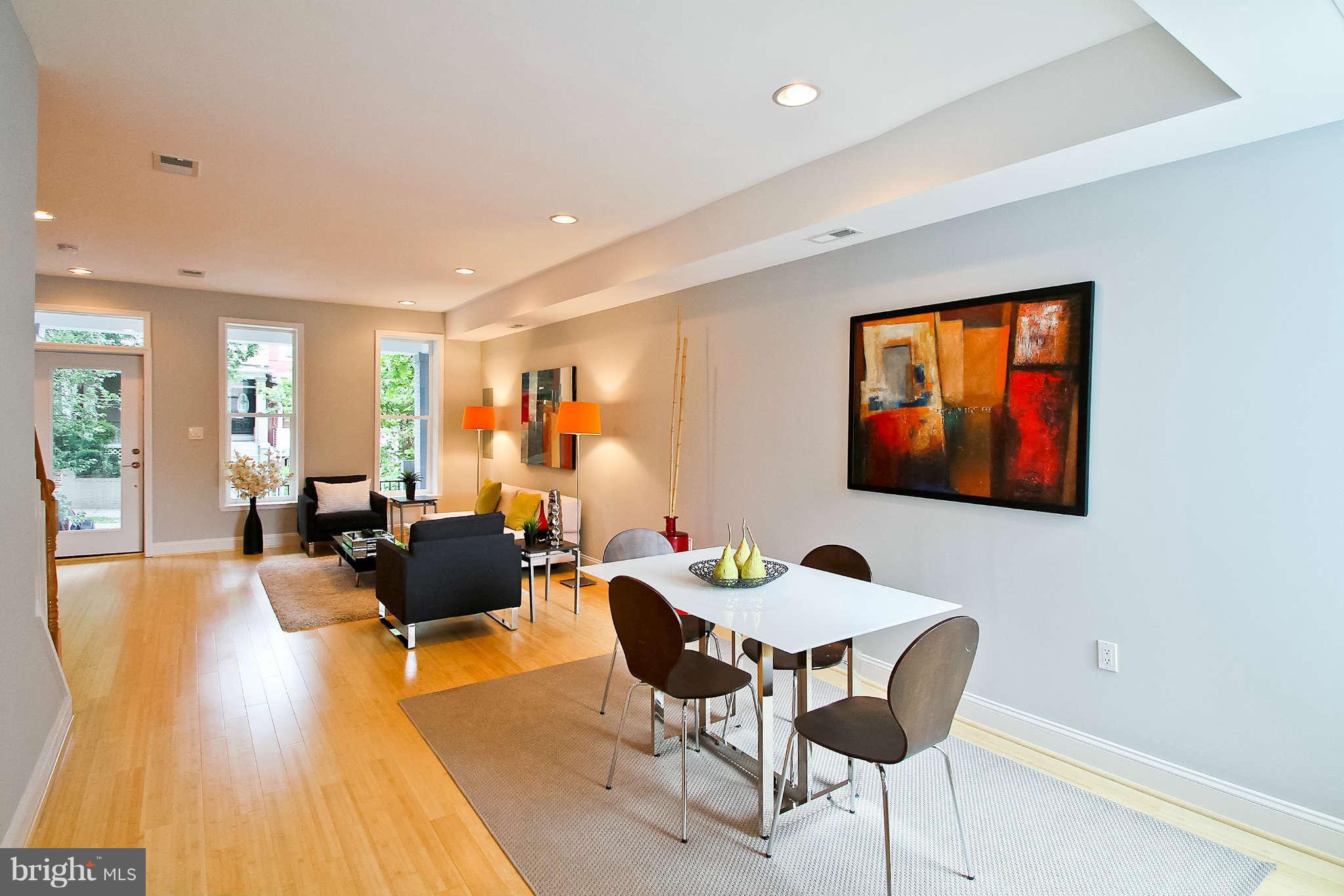 604 Columbia Road Northwest Washington, DC 20001 - Photo 4 of 25 a living room with fireplace furniture and a potted plant