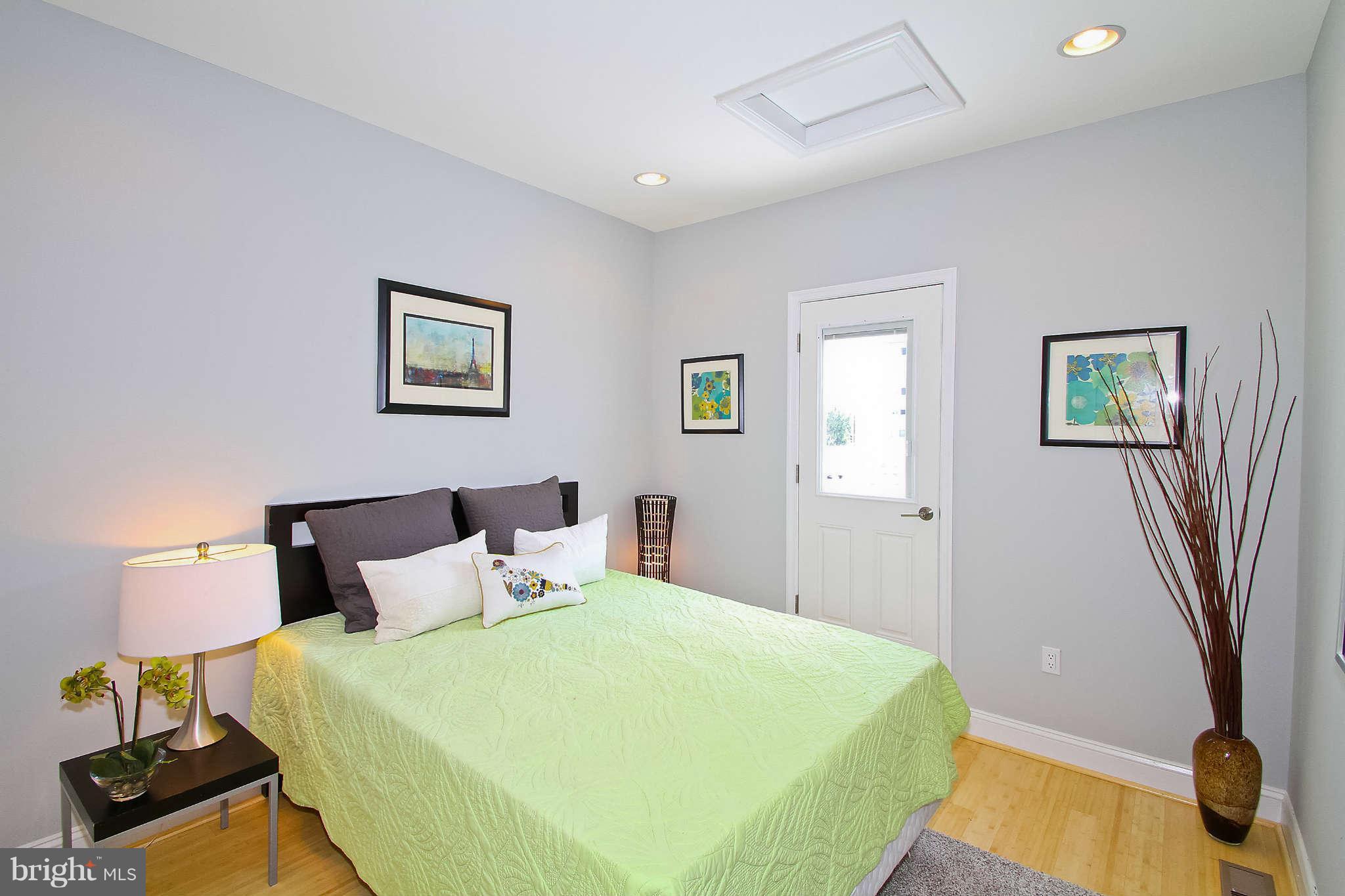 604 Columbia Road Northwest Washington, DC 20001 - Photo 10 of 25 a bedroom with bed and window