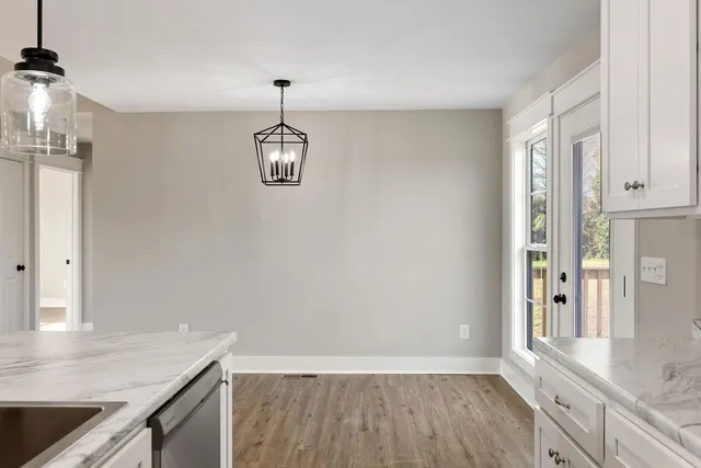 a view of a kitchen from the hallway