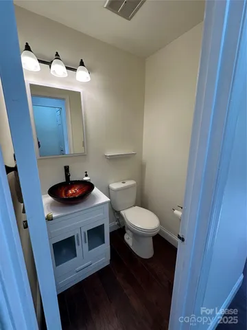 a bathroom with a toilet and a sink