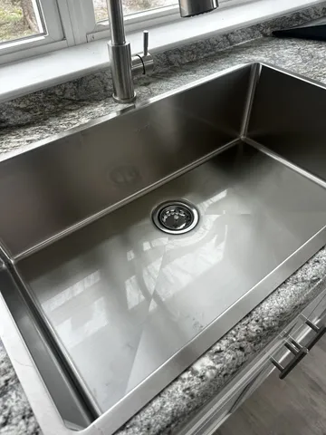 a close view of sink and microwave