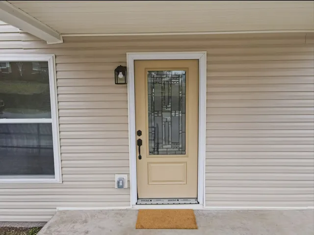 a view of a house with a door and a window
