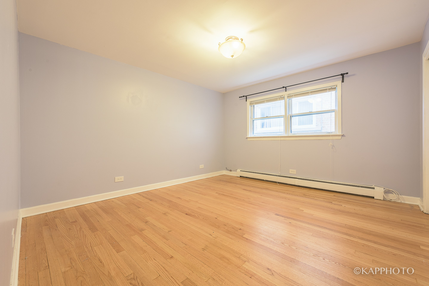 5942 West Addison Street, Unit 1 Chicago, IL 60634 - Photo 11 of 24 an empty room with a window