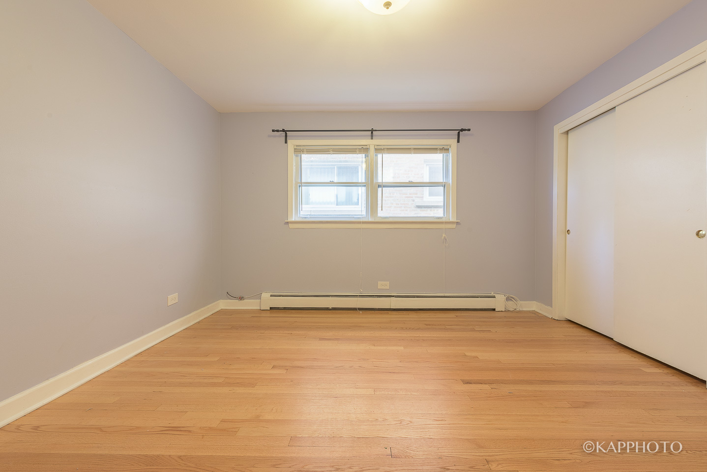 5942 West Addison Street, Unit 1 Chicago, IL 60634 - Photo 13 of 24 an empty room with a window