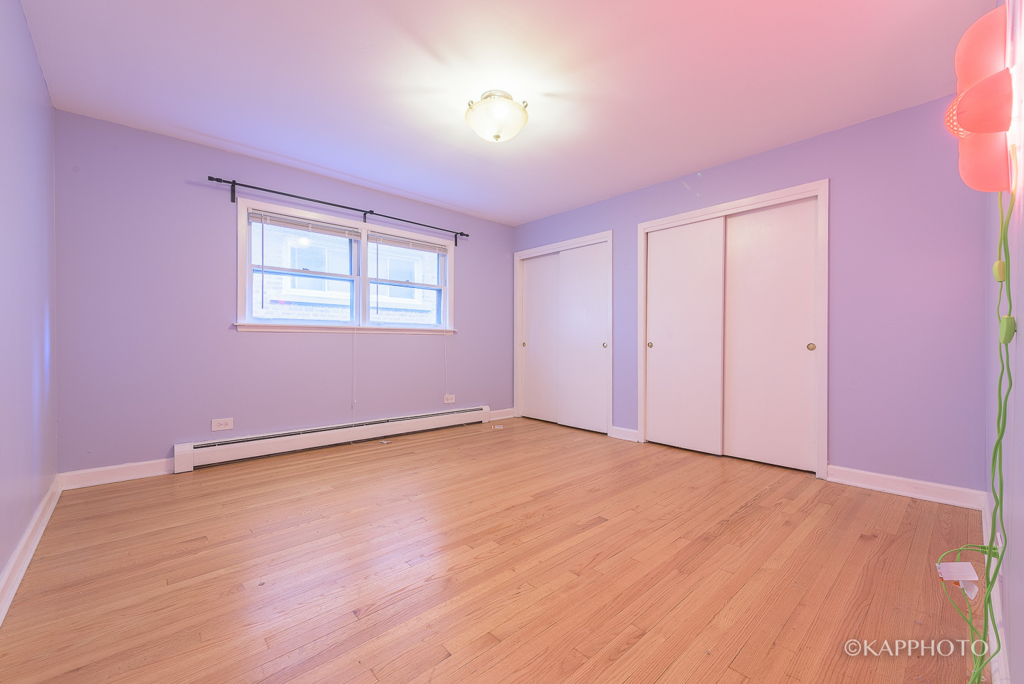 5942 West Addison Street, Unit 1 Chicago, IL 60634 - Photo 17 of 24 a view of an empty room with wooden floor and a window