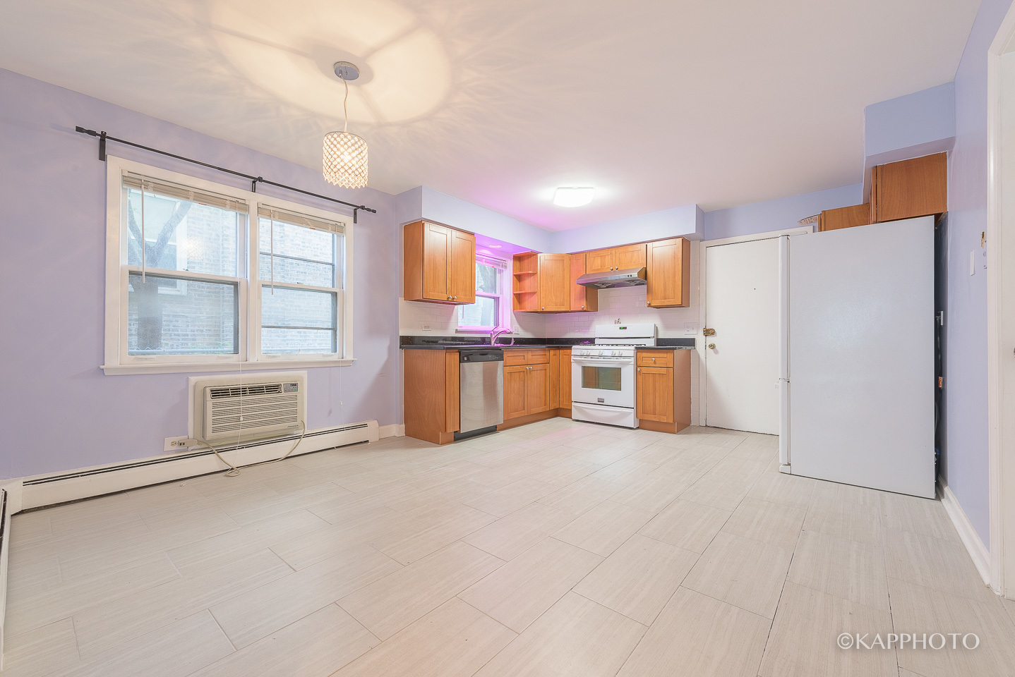5942 West Addison Street, Unit 1 Chicago, IL 60634 - Photo 8 of 24 a kitchen with stainless steel appliances a refrigerator and a stove top oven