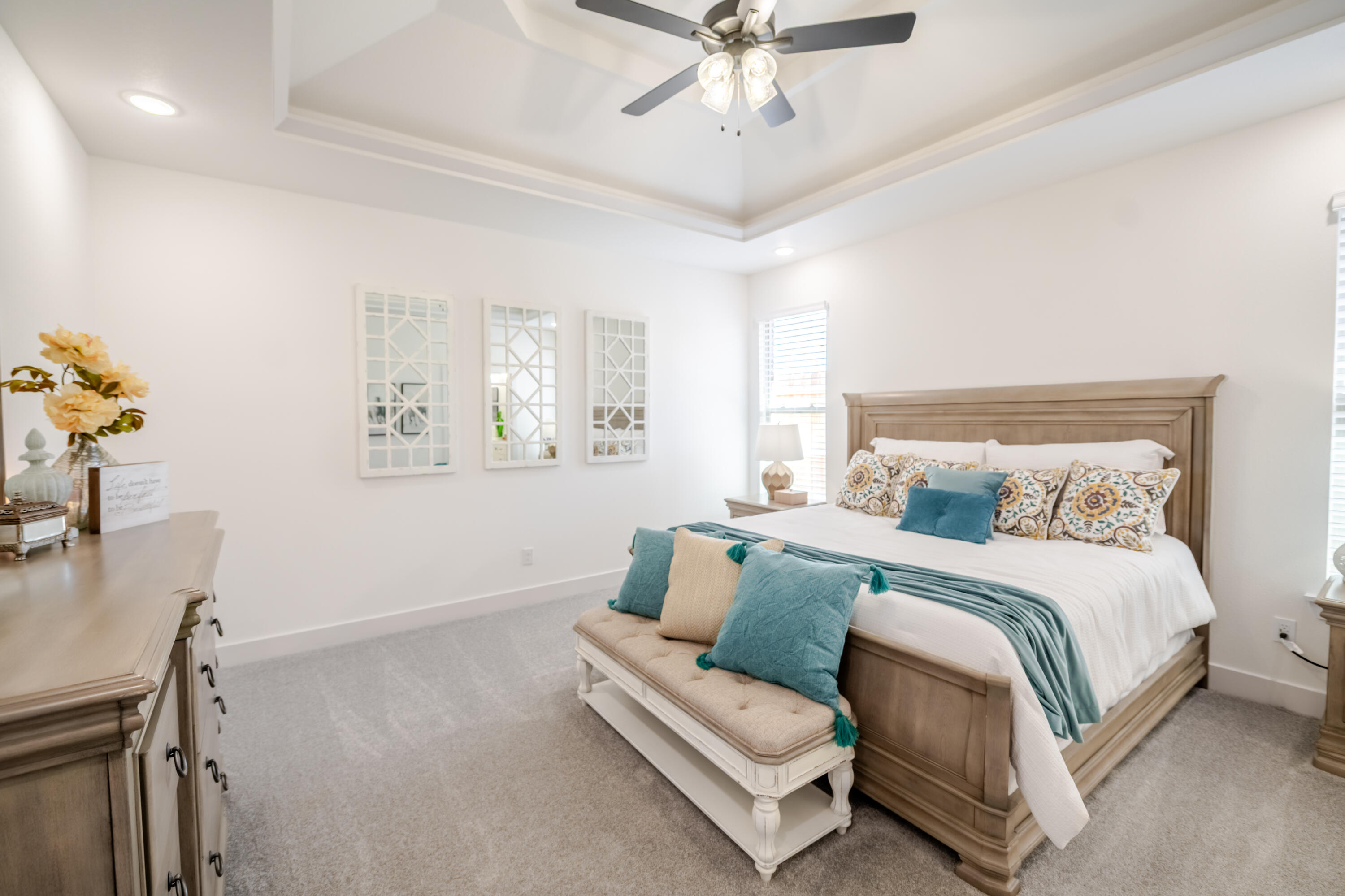 7604 58th Street Lubbock, TX 79407 - Photo 11 of 38 a spacious bedroom with a bed couch and a window