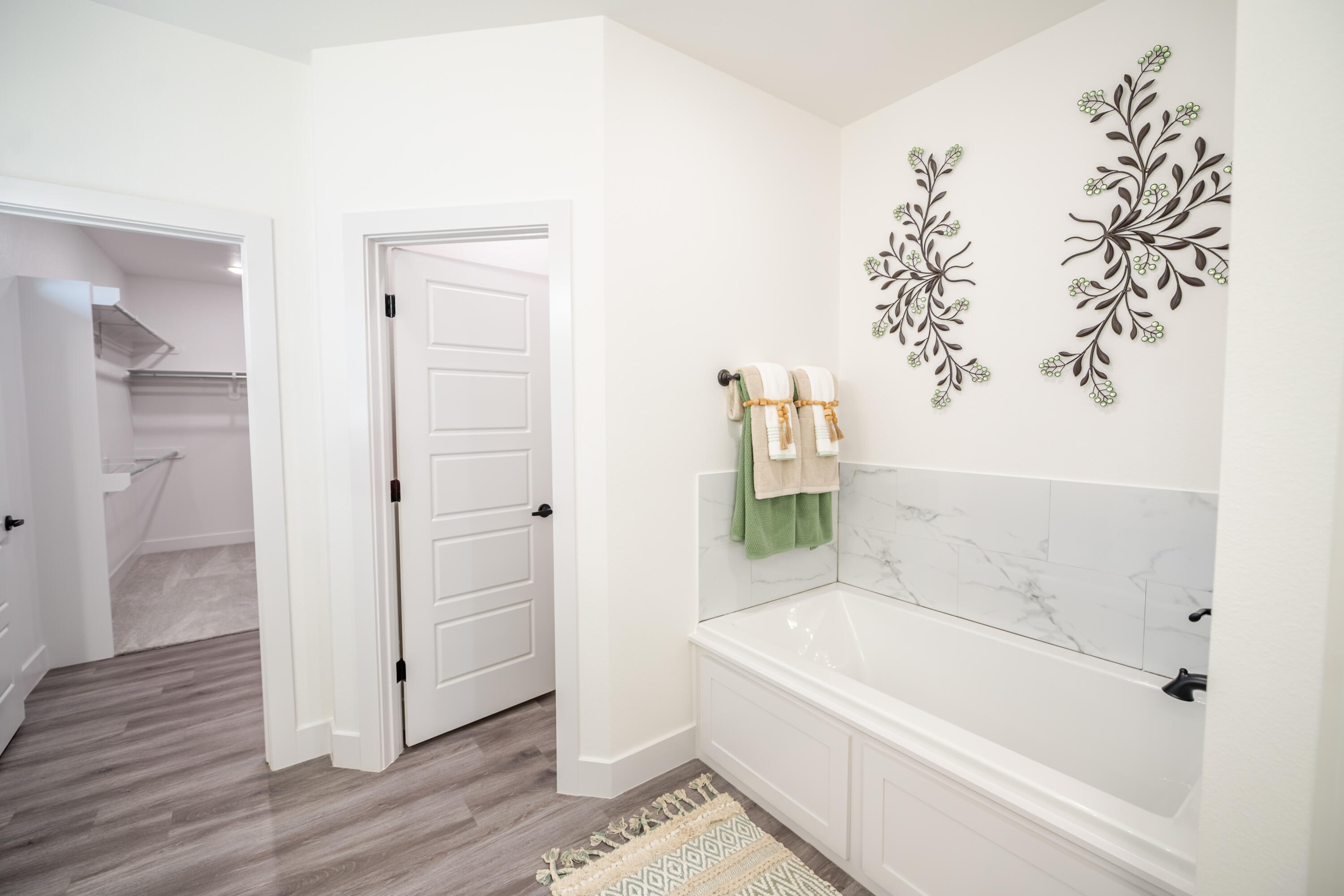 7604 58th Street Lubbock, TX 79407 - Photo 15 of 38 a white bath tub sitting next to a white door
