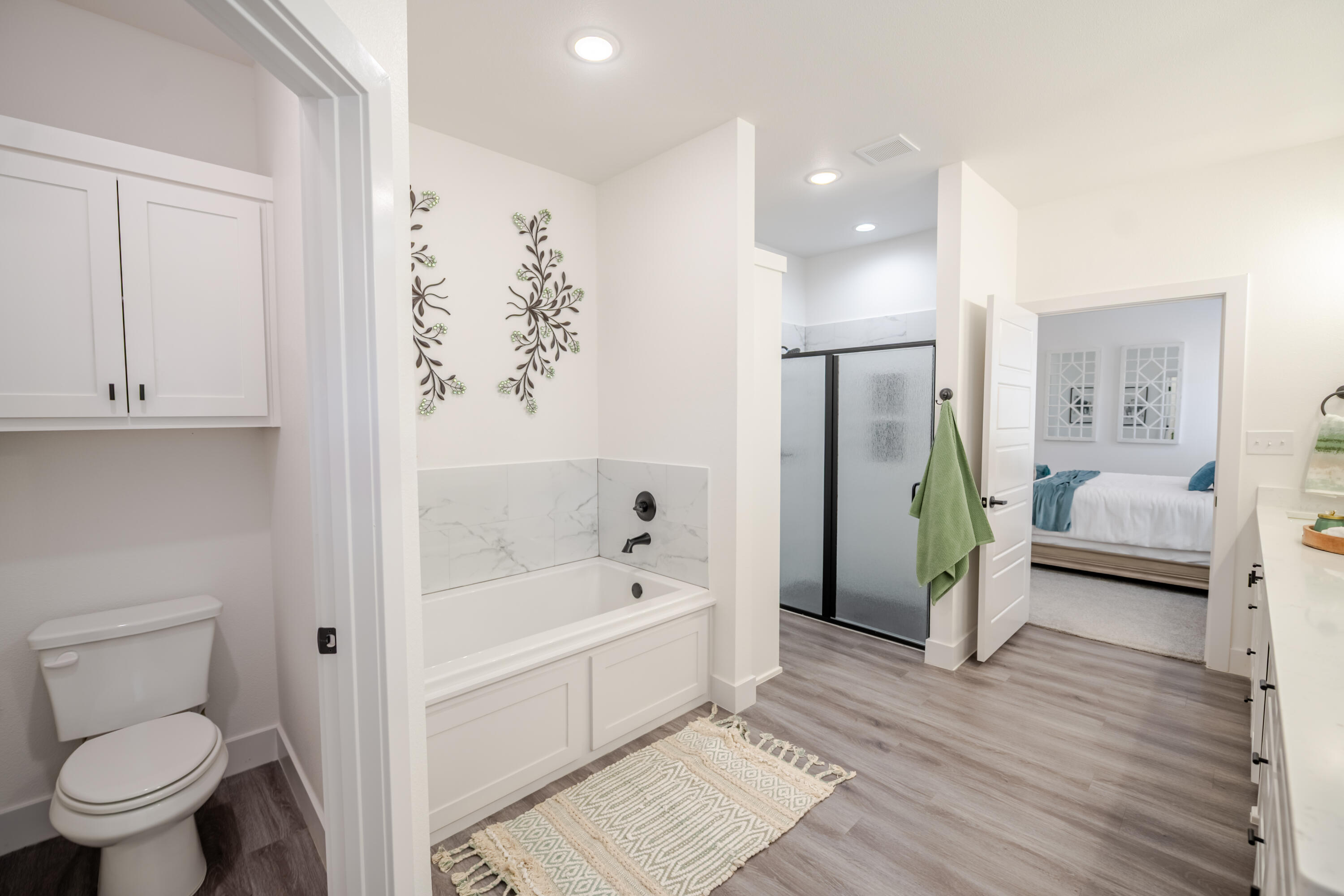 7604 58th Street Lubbock, TX 79407 - Photo 16 of 38 a bathroom with a tub and a shower