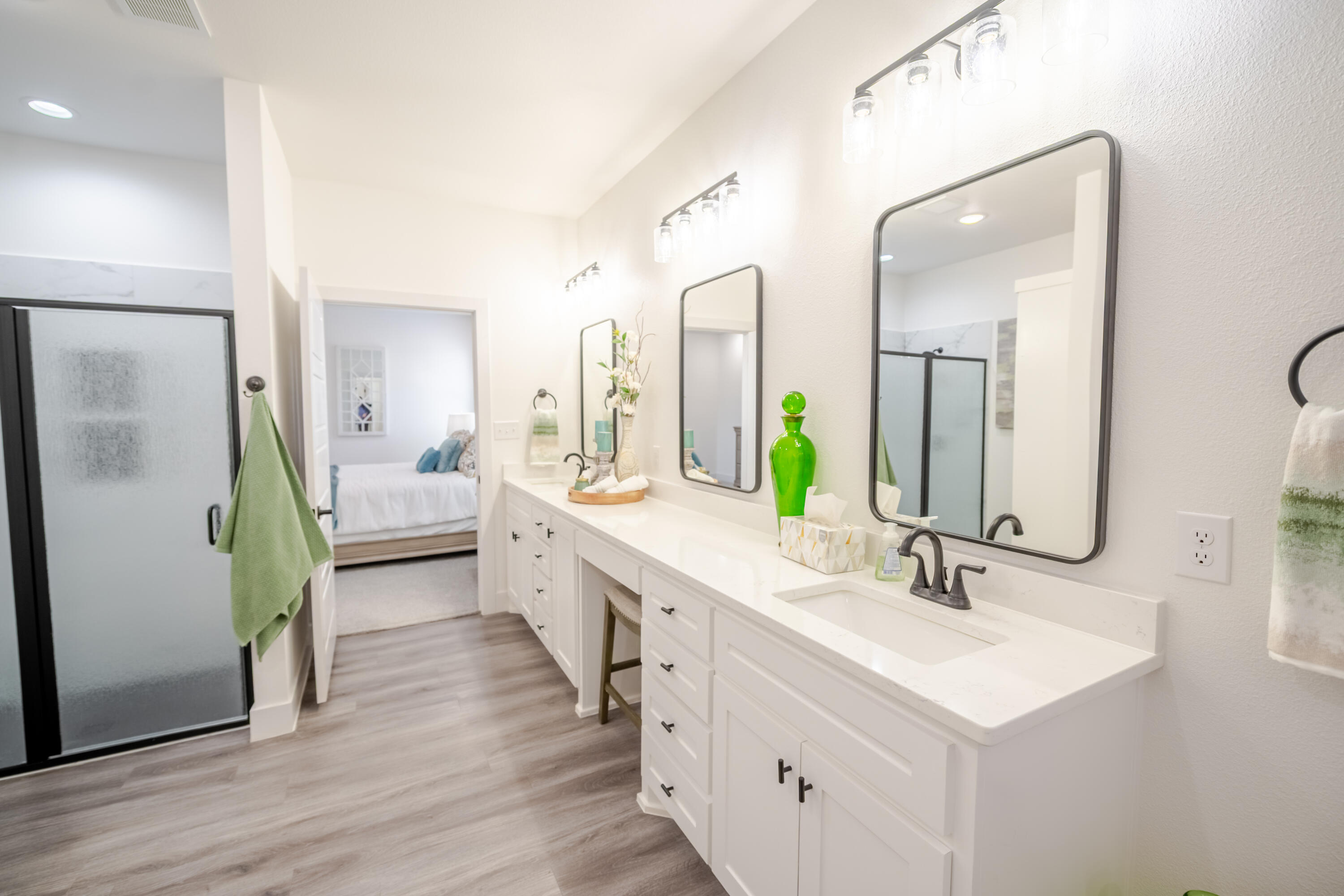 7604 58th Street Lubbock, TX 79407 - Photo 17 of 38 a bathroom with a double vanity sink and a mirror