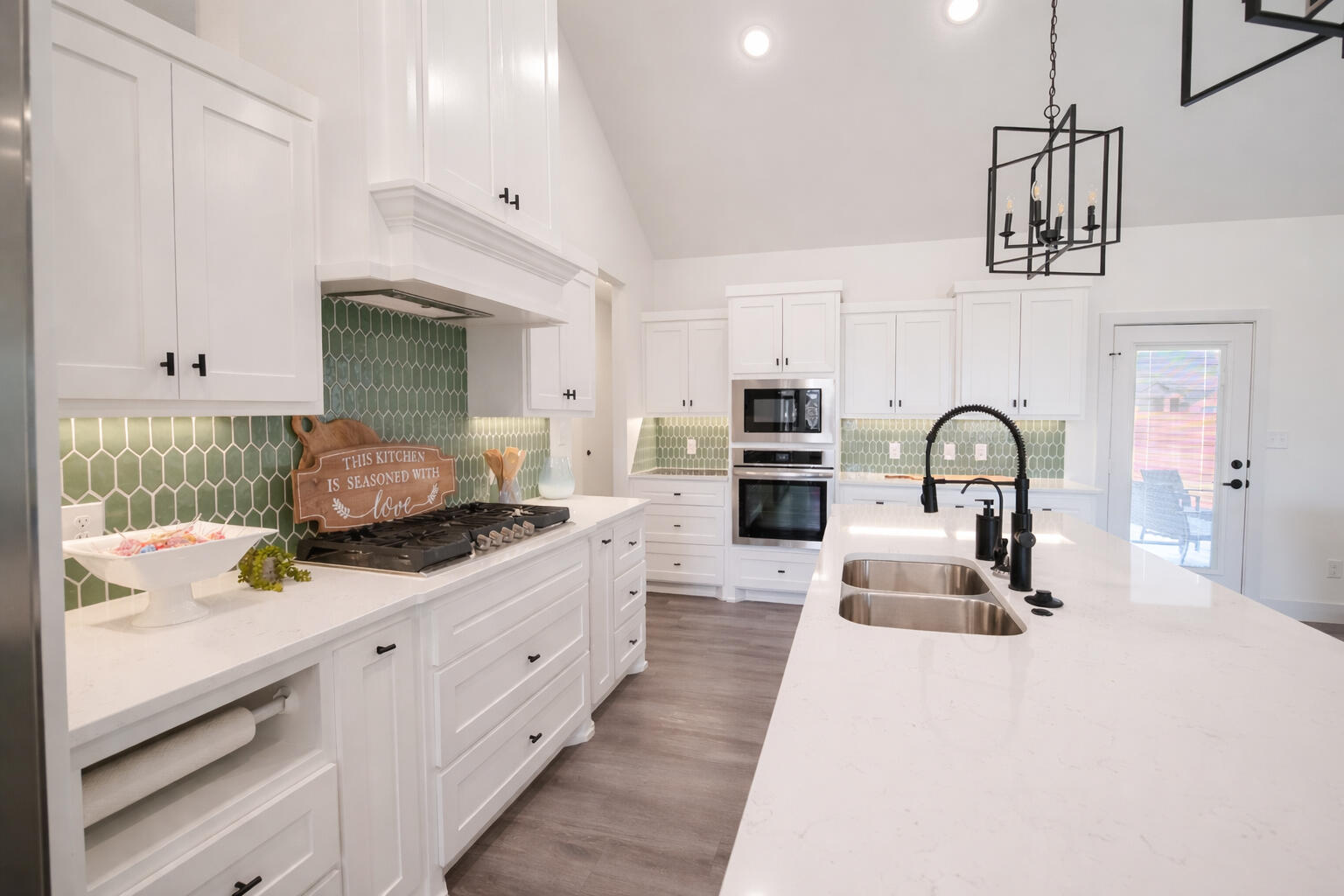 7604 58th Street Lubbock, TX 79407 - Photo 3 of 38 a kitchen with stainless steel appliances a sink stove and cabinets
