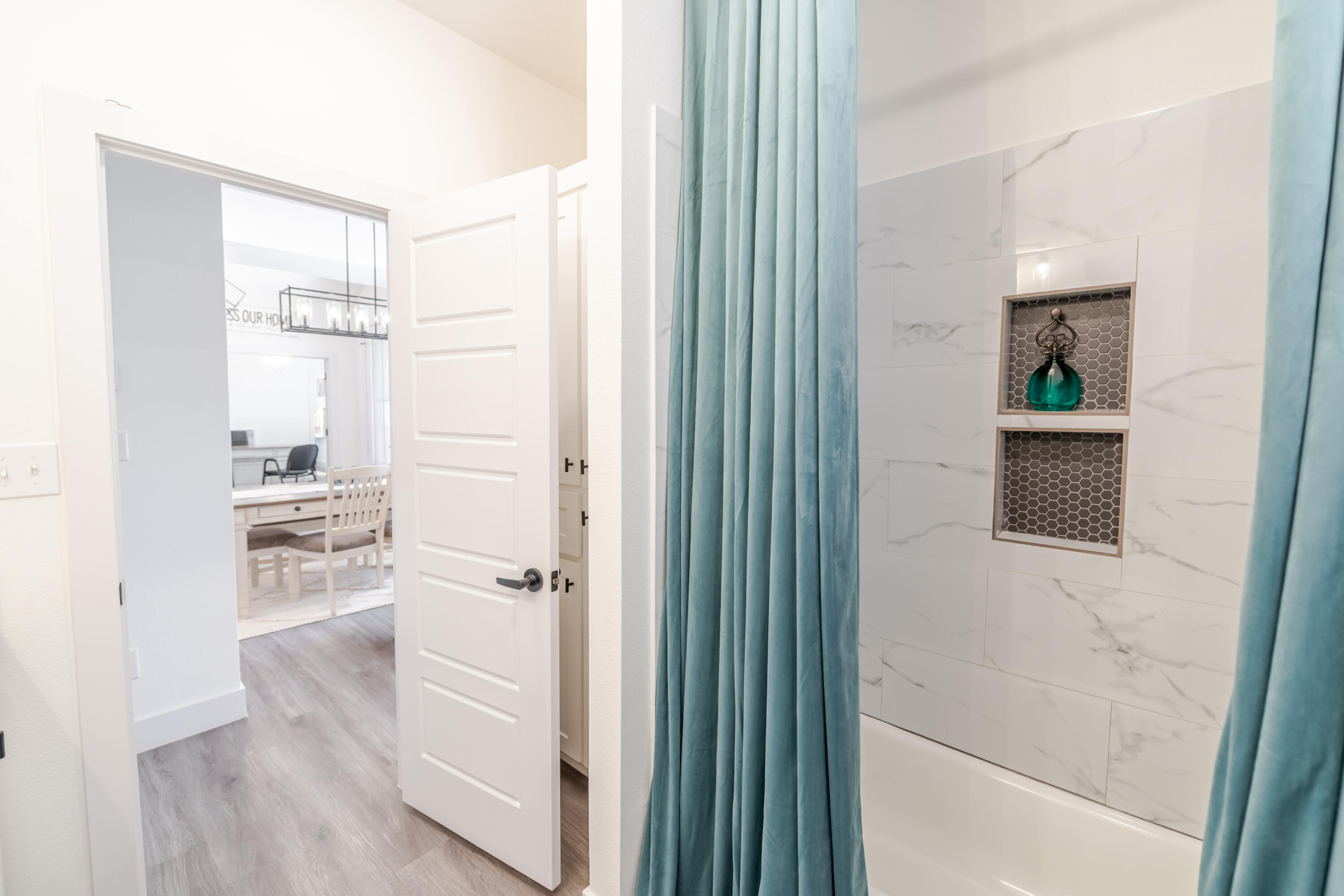 7604 58th Street Lubbock, TX 79407 - Photo 31 of 38 a bathroom with a shower and a sink