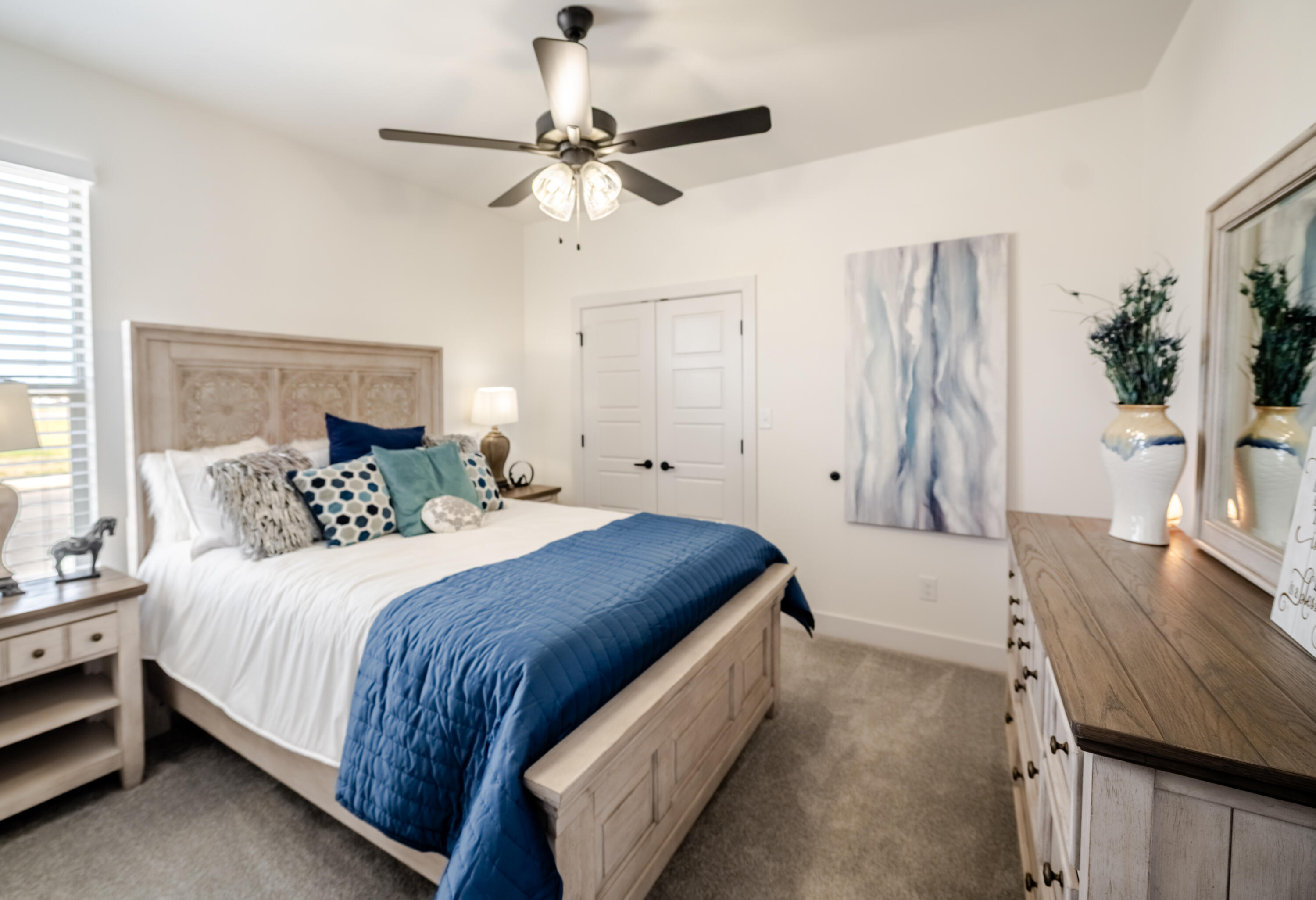 7604 58th Street Lubbock, TX 79407 - Photo 32 of 38 a bedroom with a bed and a table