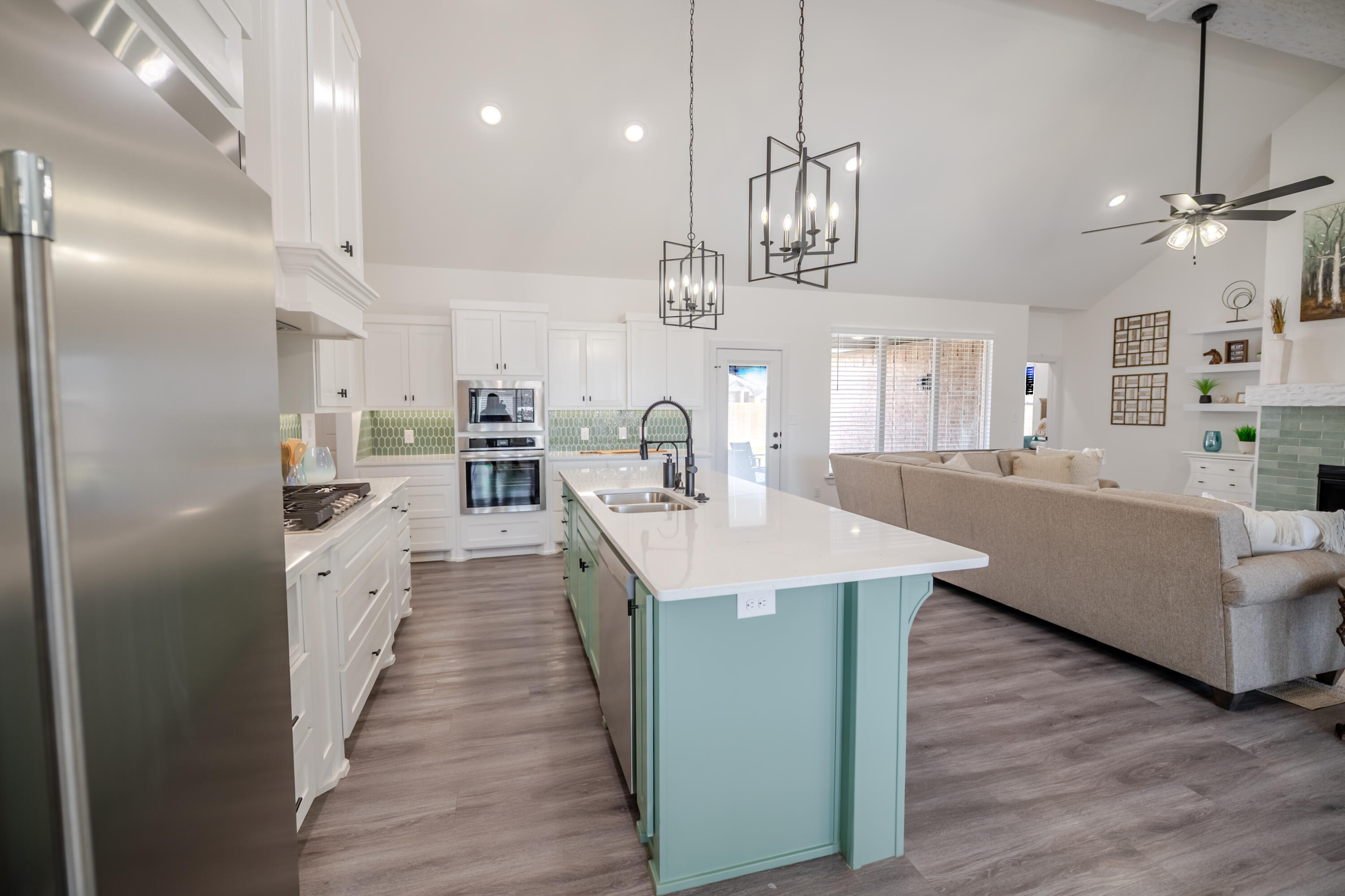 7604 58th Street Lubbock, TX 79407 - Photo 38 of 38 a large kitchen with stainless steel appliances kitchen island a large island in the center