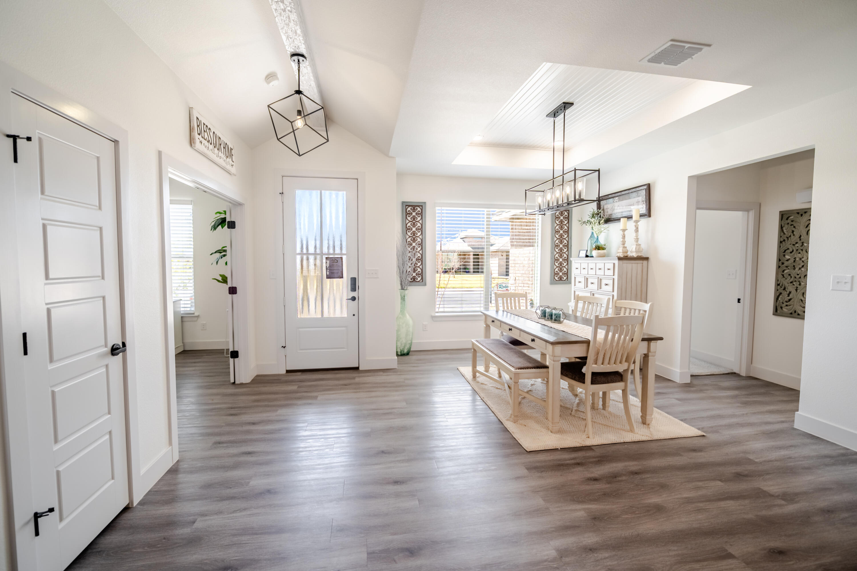 7604 58th Street Lubbock, TX 79407 - Photo 6 of 38 a view of a dining room with furniture and wooden floor