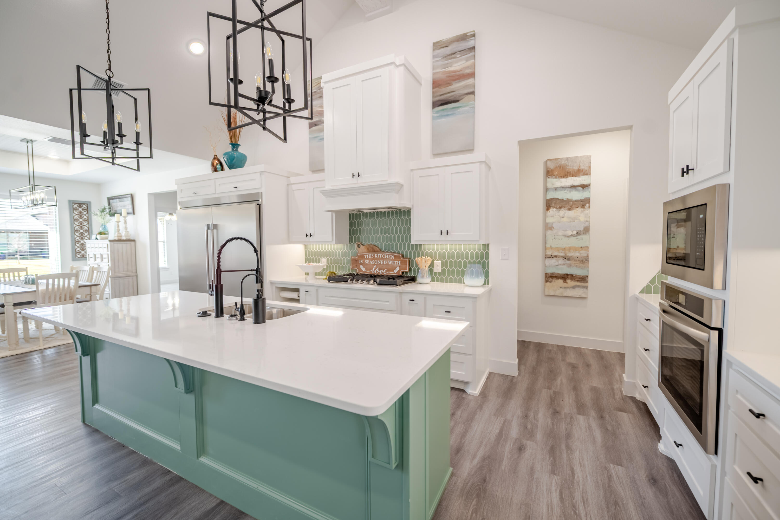 7604 58th Street Lubbock, TX 79407 - Photo 8 of 38 a kitchen with stainless steel appliances a sink stove and refrigerator