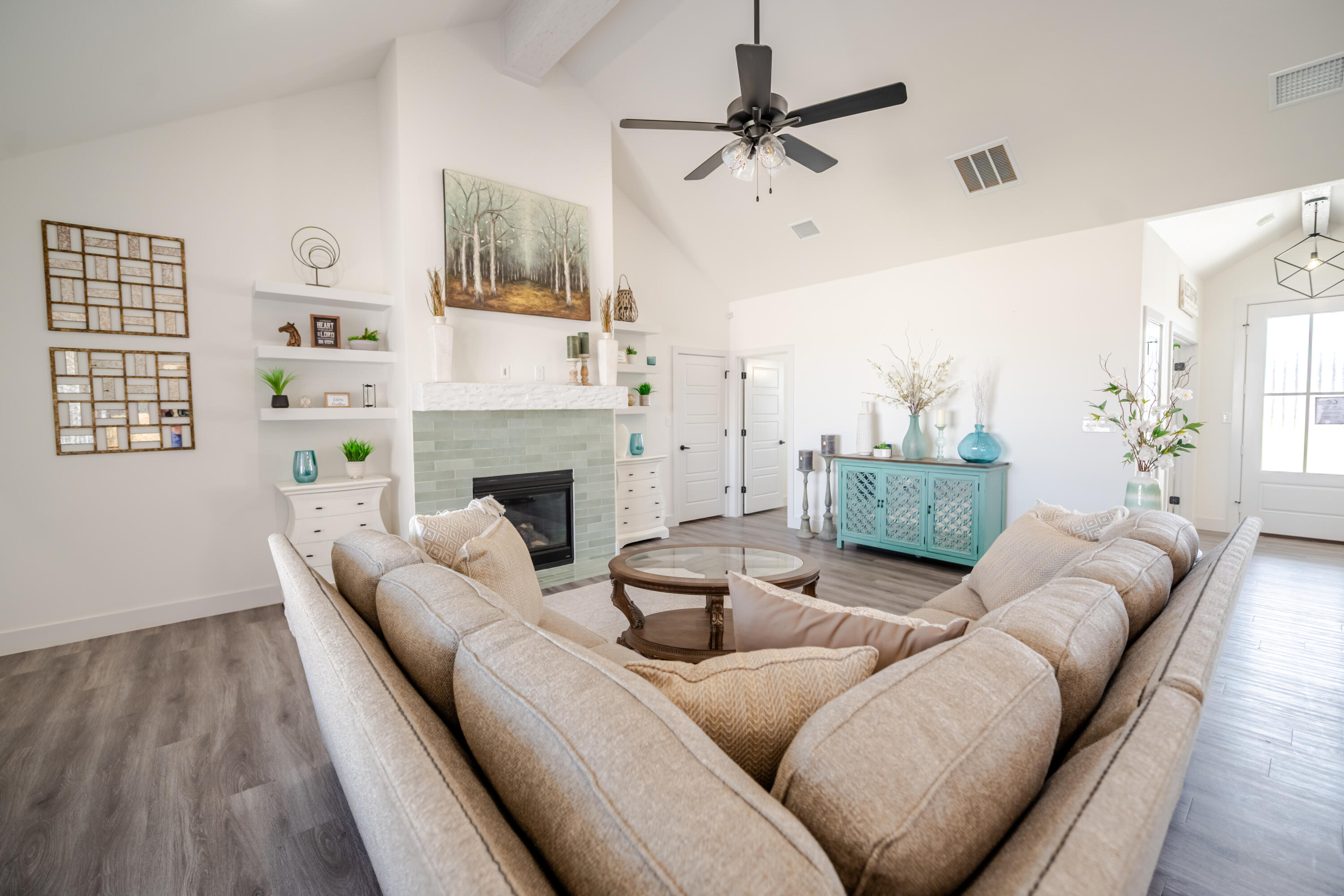 7604 58th Street Lubbock, TX 79407 - Photo 9 of 38 a living room with furniture and a fireplace