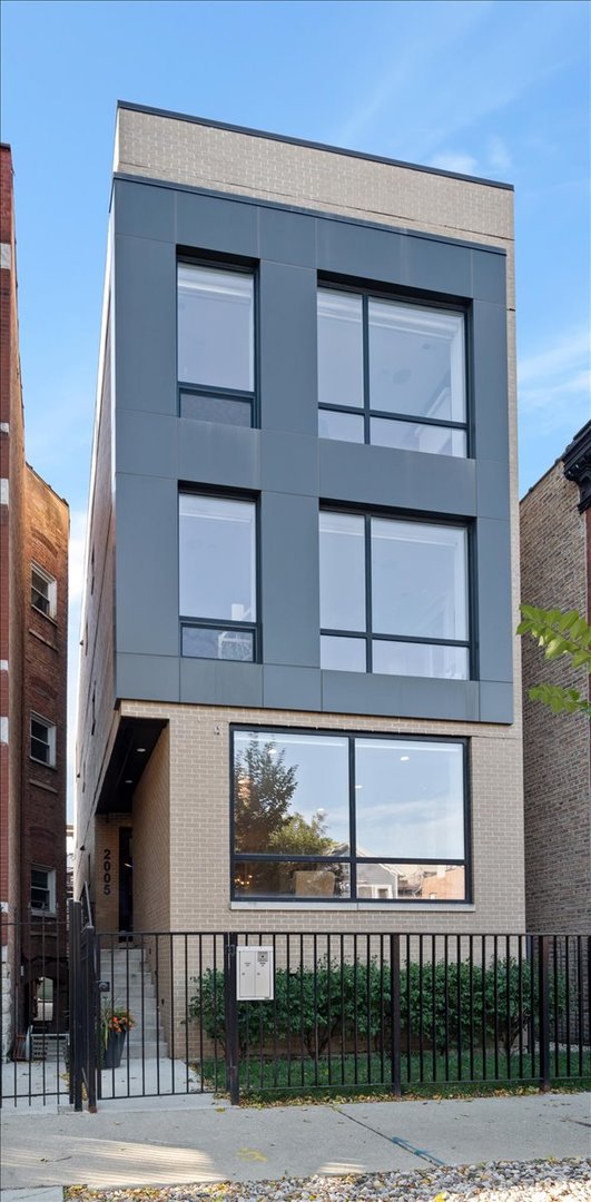 a front view of a building with glass windows