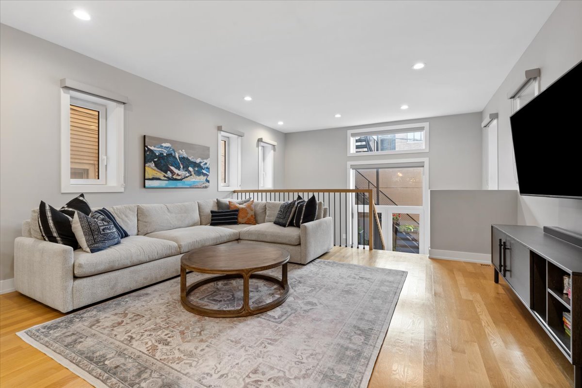 2005 West Huron Street, Unit 1 Chicago, IL 60612 - Photo 11 of 30 a living room with furniture and a flat screen tv