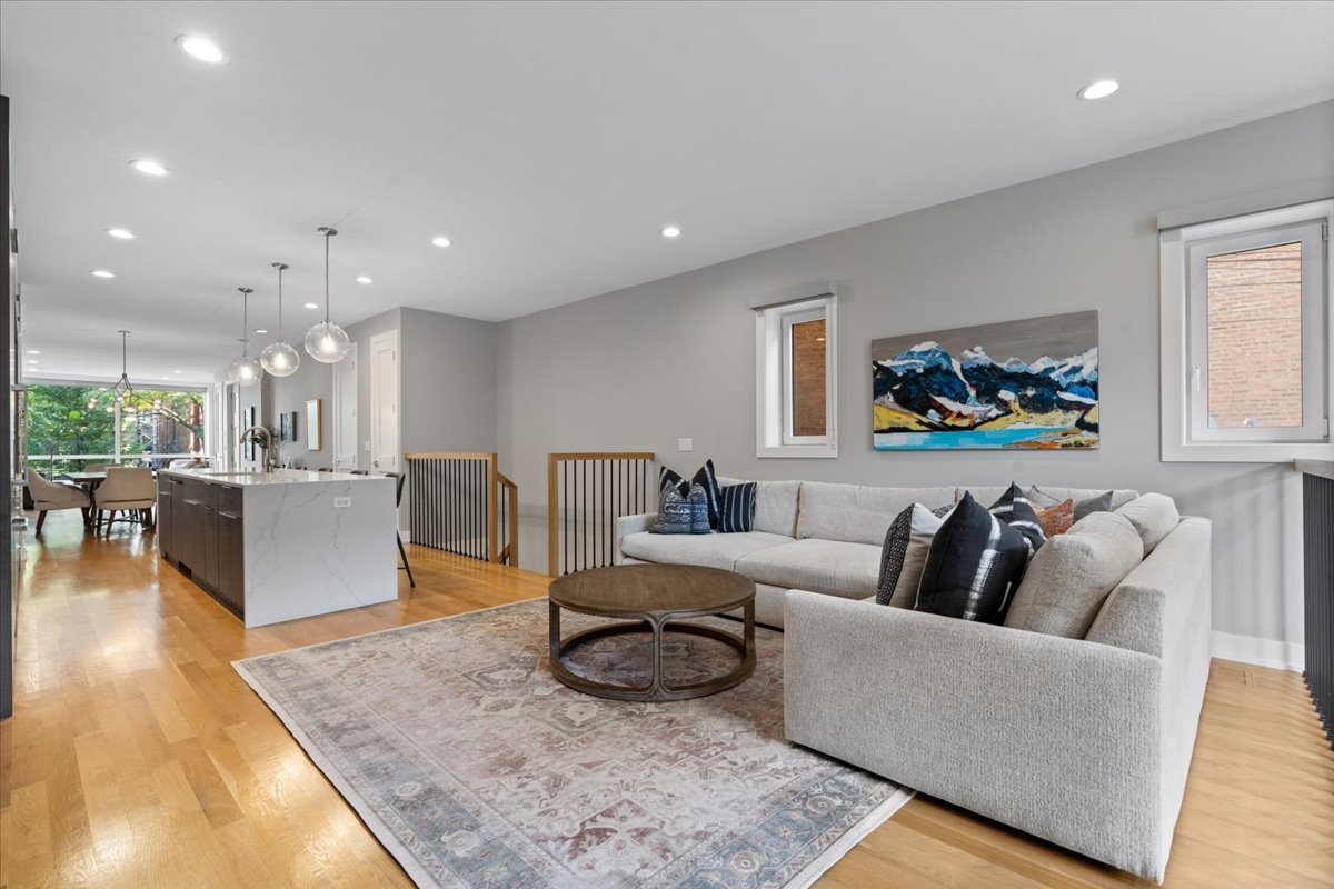 2005 West Huron Street, Unit 1 Chicago, IL 60612 - Photo 12 of 30 a living room with furniture and a wooden floor