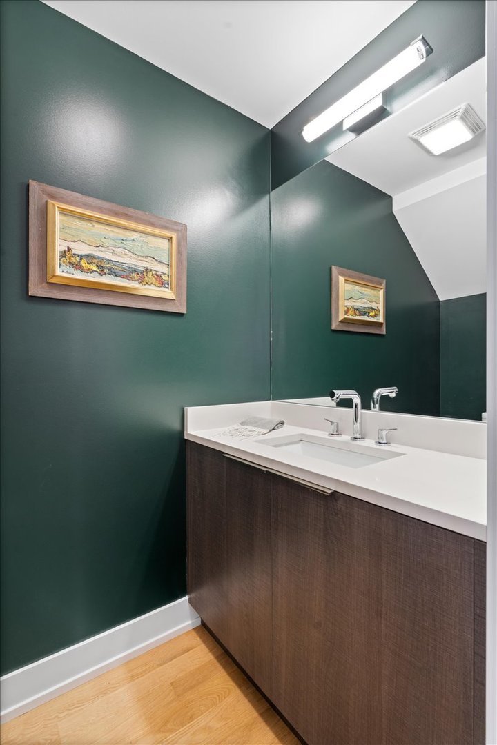 2005 West Huron Street, Unit 1 Chicago, IL 60612 - Photo 13 of 30 a bathroom with a sink and a mirror