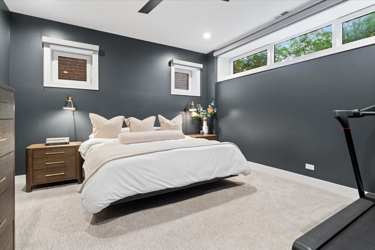 2005 West Huron Street, Unit 1 Chicago, IL 60612 - Photo 15 of 30 a bedroom with a bed and a couch