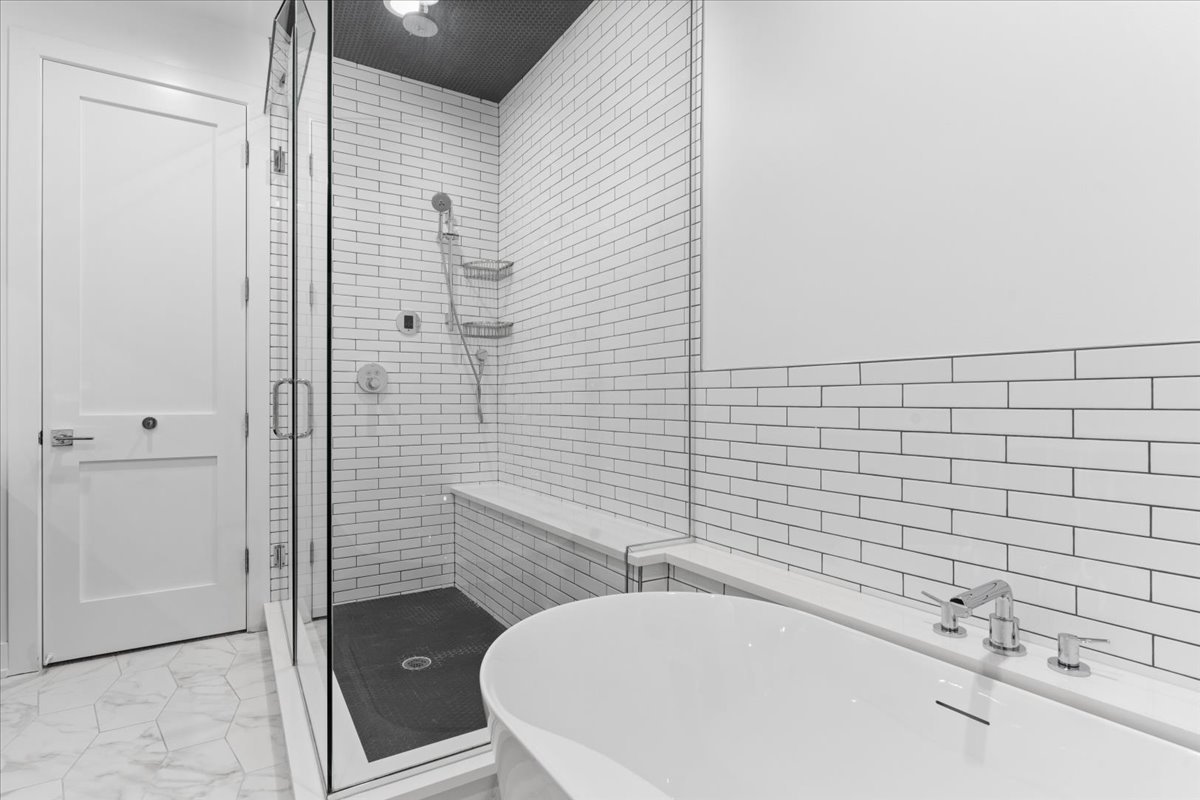 2005 West Huron Street, Unit 1 Chicago, IL 60612 - Photo 17 of 30 a bathroom with a bathtub and shower