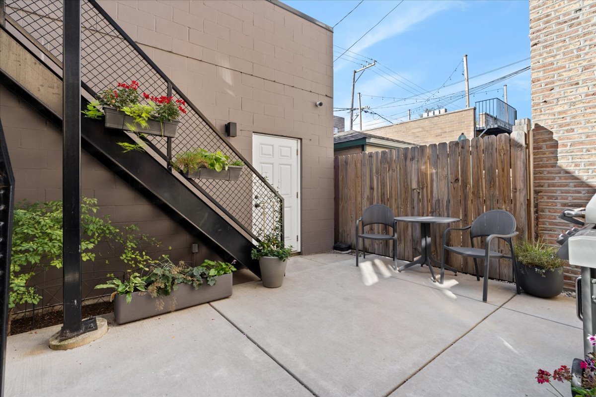 2005 West Huron Street, Unit 1 Chicago, IL 60612 - Photo 25 of 30 a view of a chairs and table in the balcony