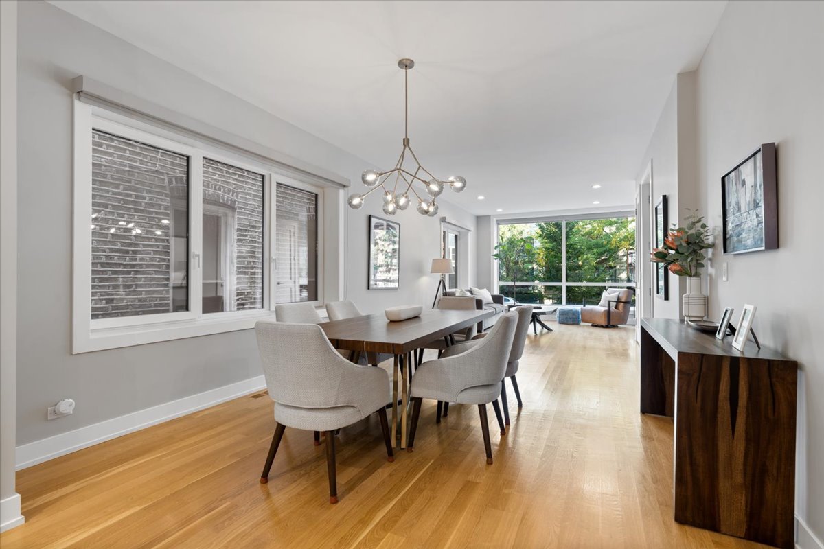 2005 West Huron Street, Unit 1 Chicago, IL 60612 - Photo 7 of 30 a view of a dining room with furniture window and wooden floor