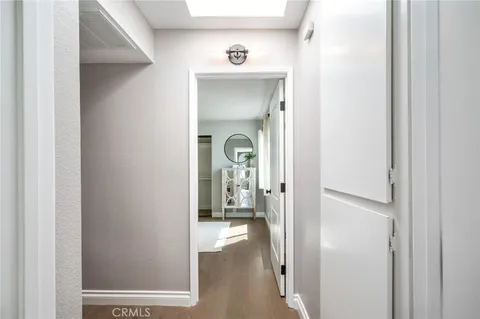 a view of a hallway with a livingroom and a gallery view