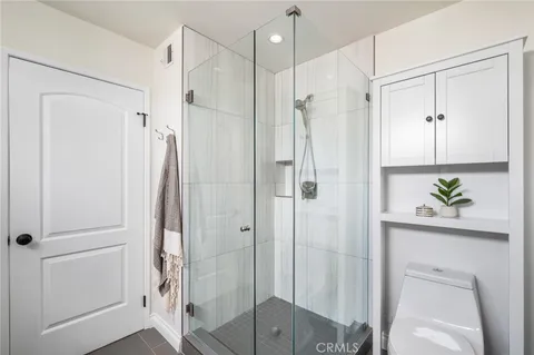 a bathroom with a shower and a shower
