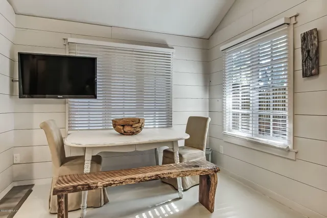 a work place with a chair and a refrigerator