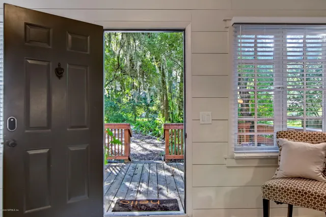 a living room with furniture and a gate