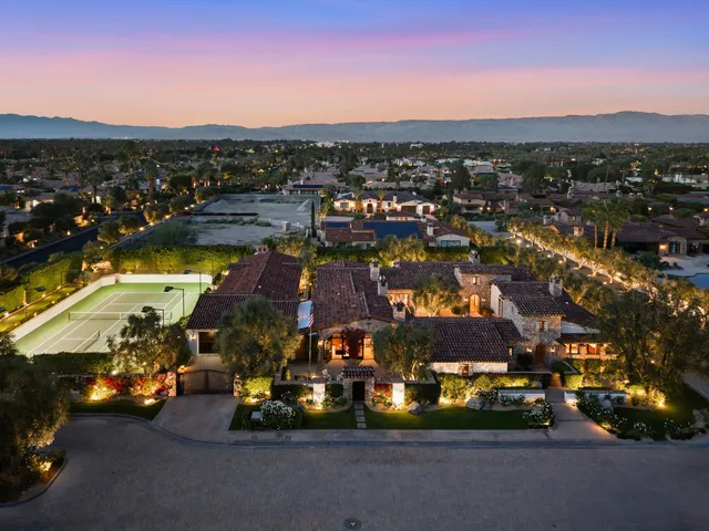 a bathroom with a sink shower and a mirror