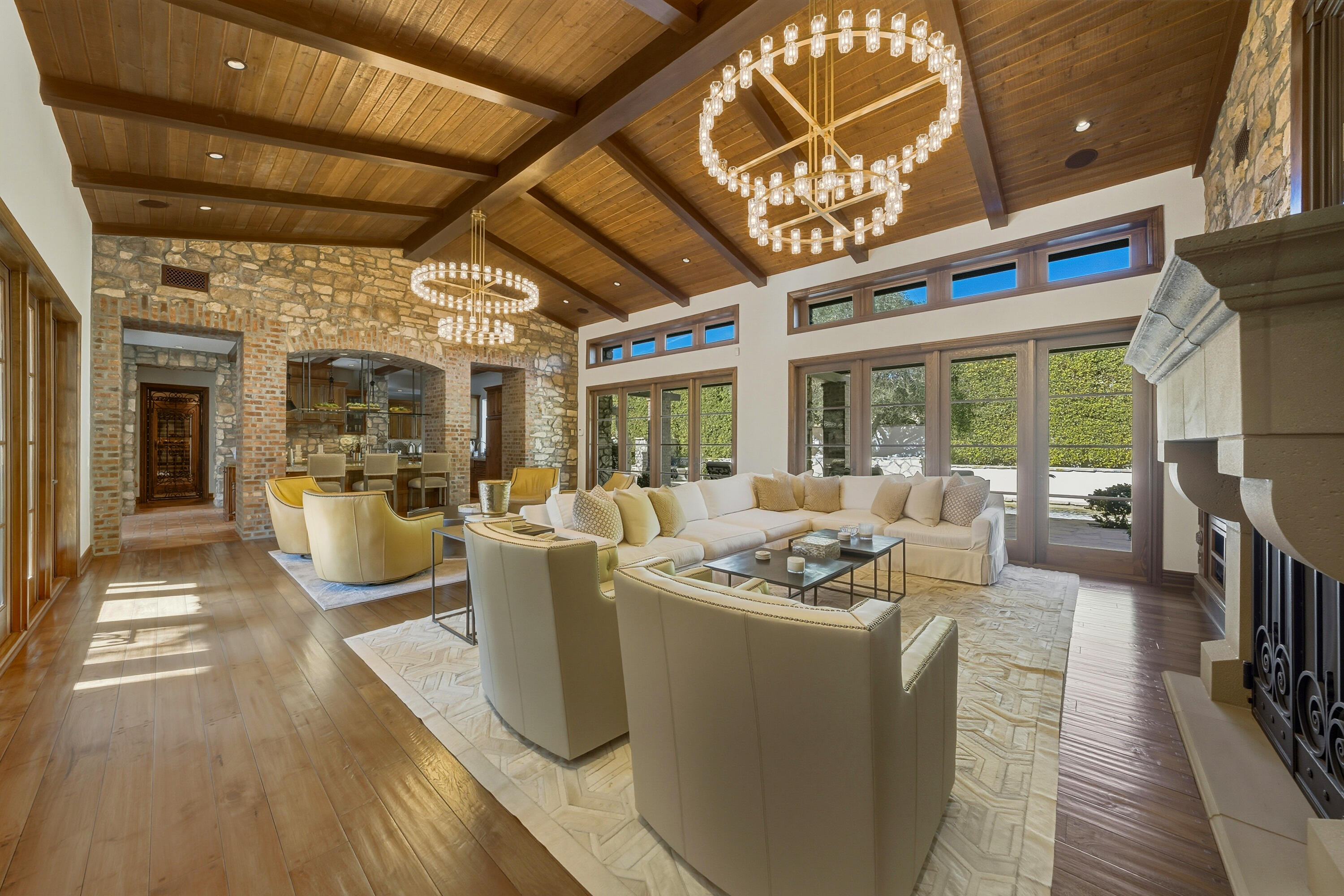 4 Via L' Antico Rancho Mirage, CA 92270 - Photo 17 of 75 a living room with furniture a flat screen tv and floor to ceiling window