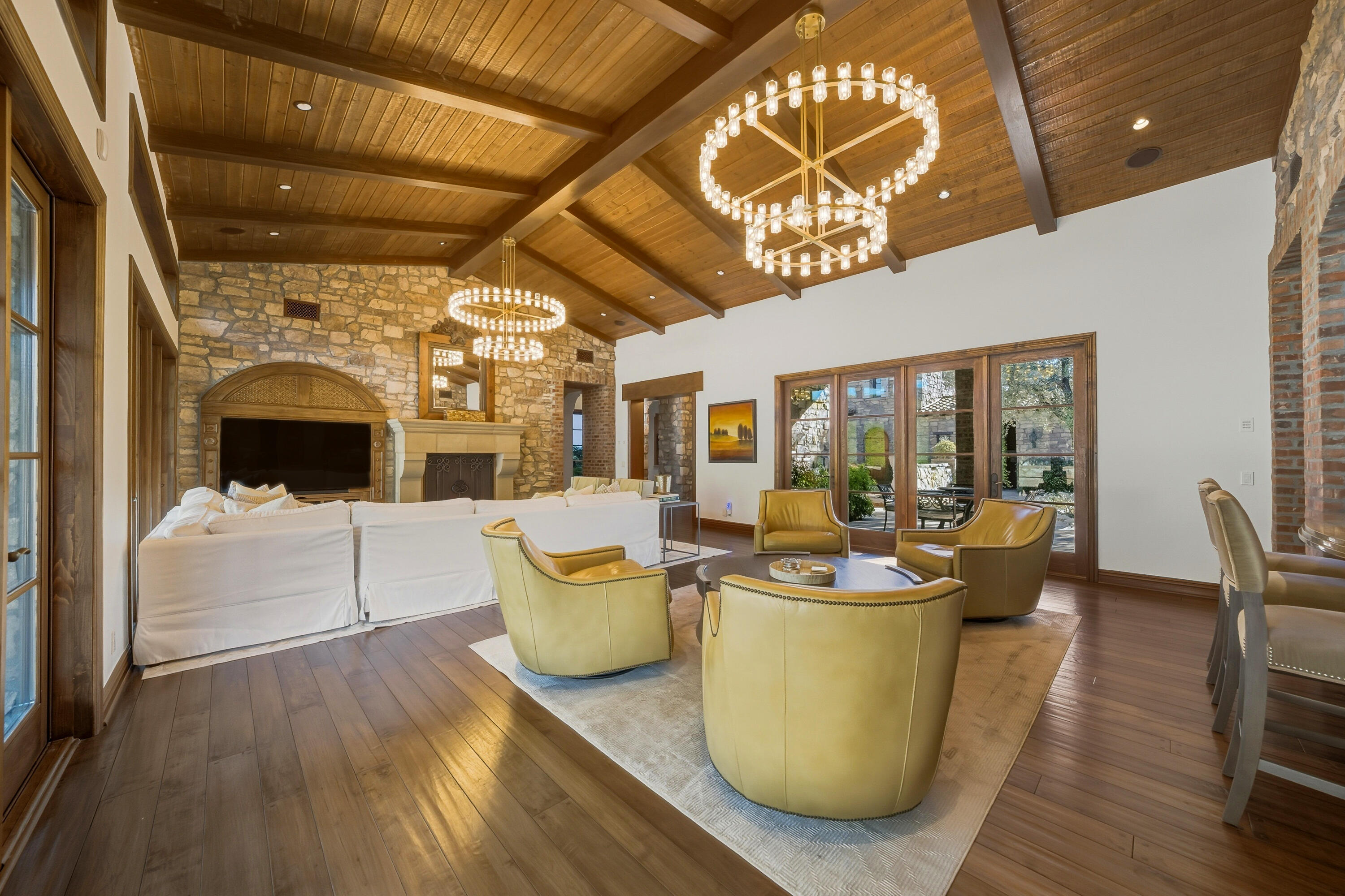 4 Via L' Antico Rancho Mirage, CA 92270 - Photo 19 of 75 a living room with furniture and a fireplace