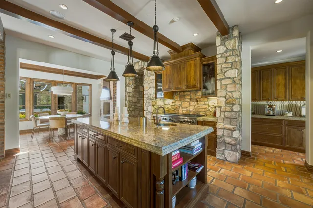 a spacious bedroom with a large bed and a wooden floor