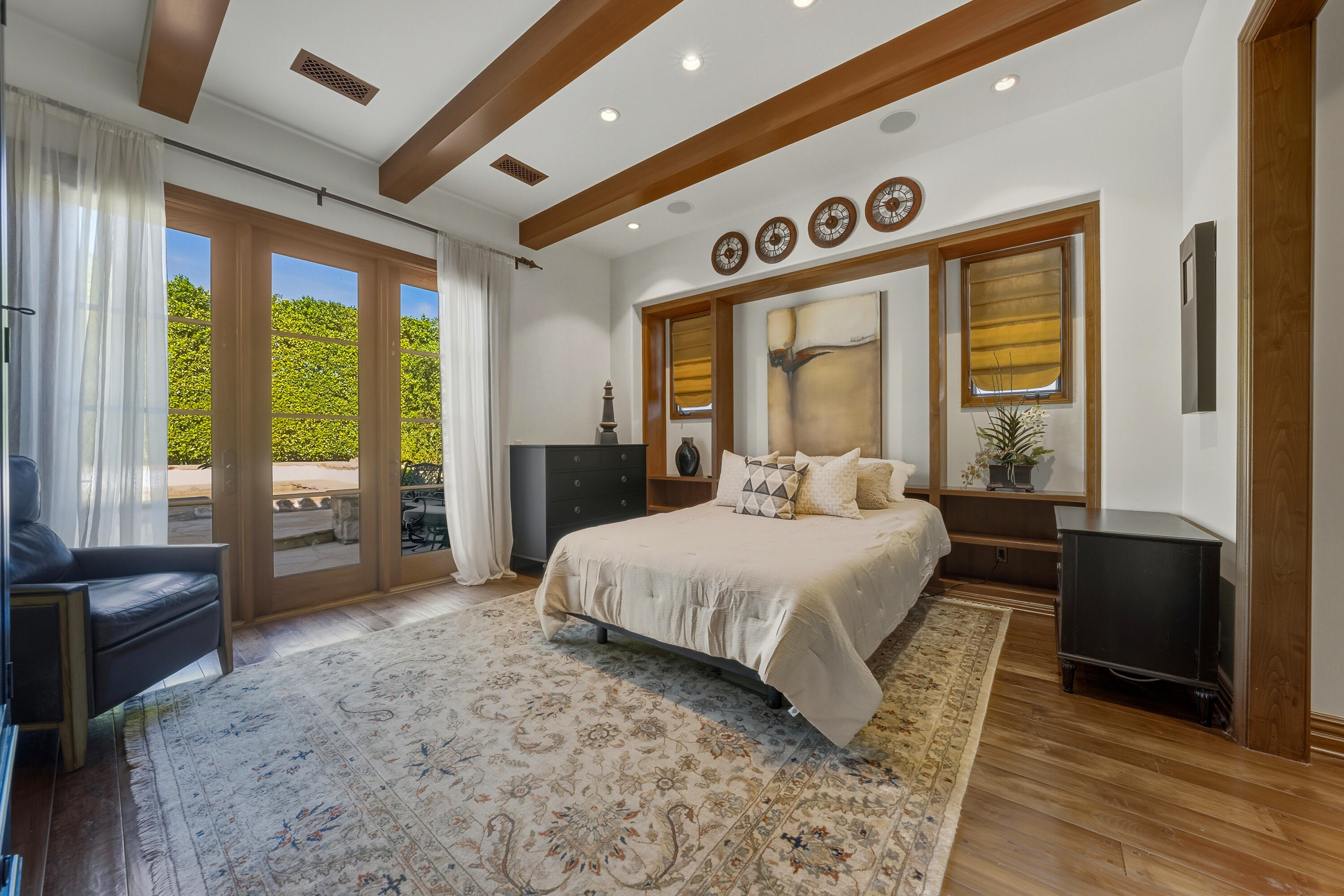 4 Via L' Antico Rancho Mirage, CA 92270 - Photo 32 of 75 a spacious bedroom with a large bed and a large window