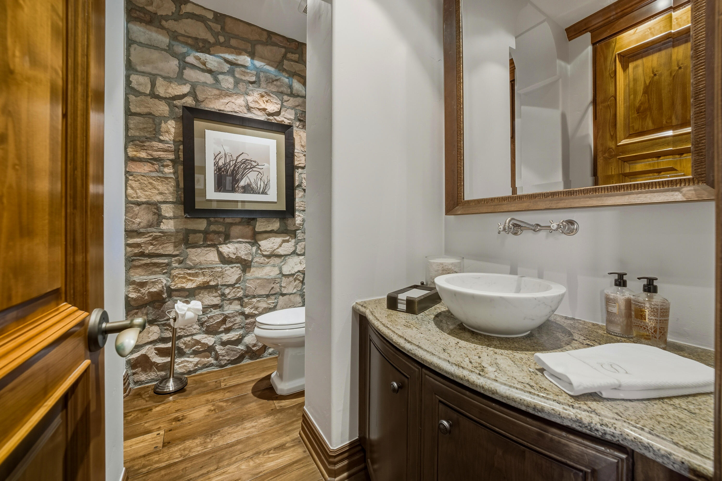 4 Via L' Antico Rancho Mirage, CA 92270 - Photo 39 of 75 a bathroom with a granite countertop toilet a sink and a mirror