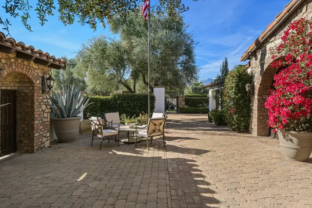 a view of a big house with a big yard