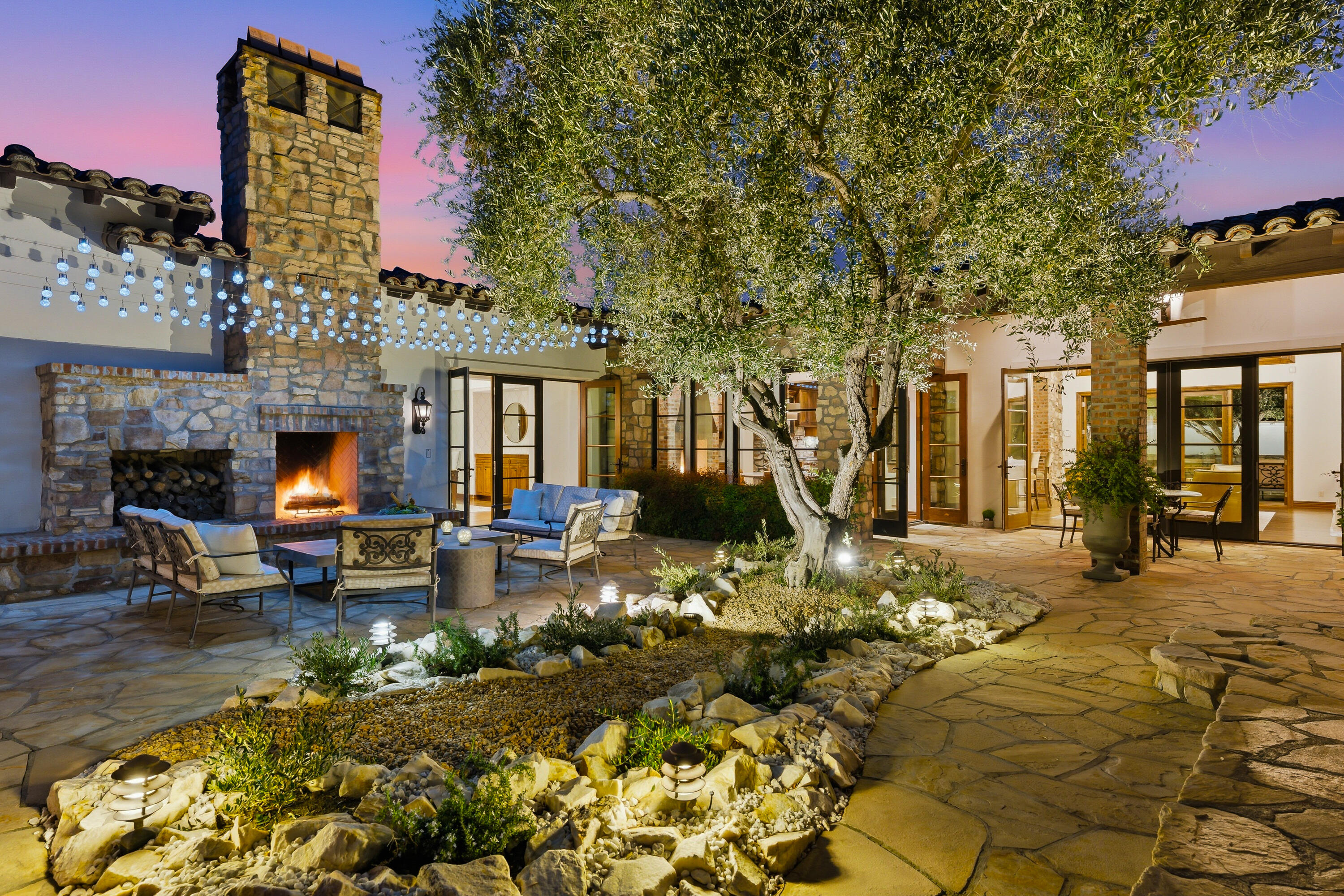4 Via L' Antico Rancho Mirage, CA 92270 - Photo 5 of 75 a view of a house with swimming pool and sitting area