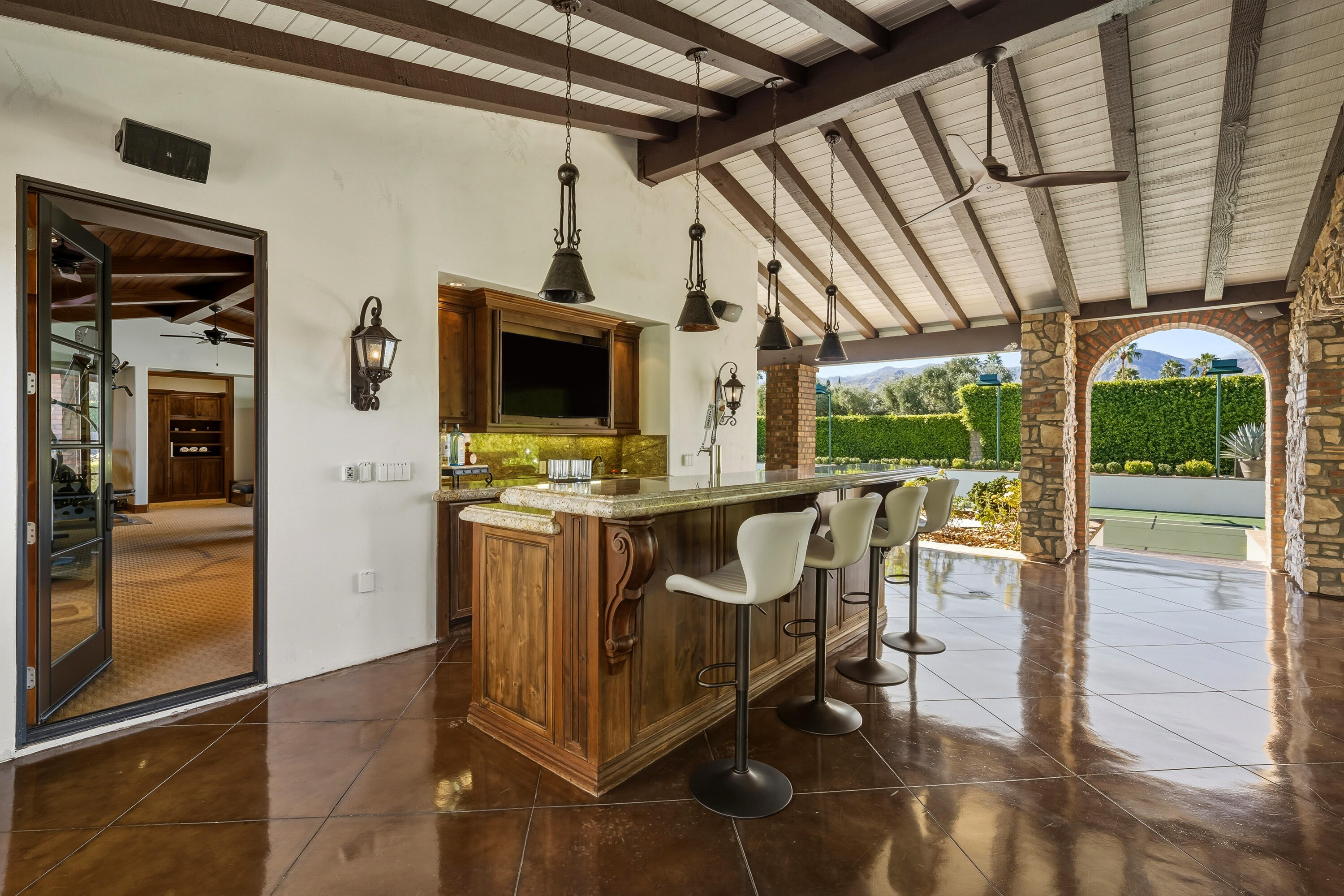 4 Via L' Antico Rancho Mirage, CA 92270 - Photo 53 of 75 a view of a chairs and table in a patio