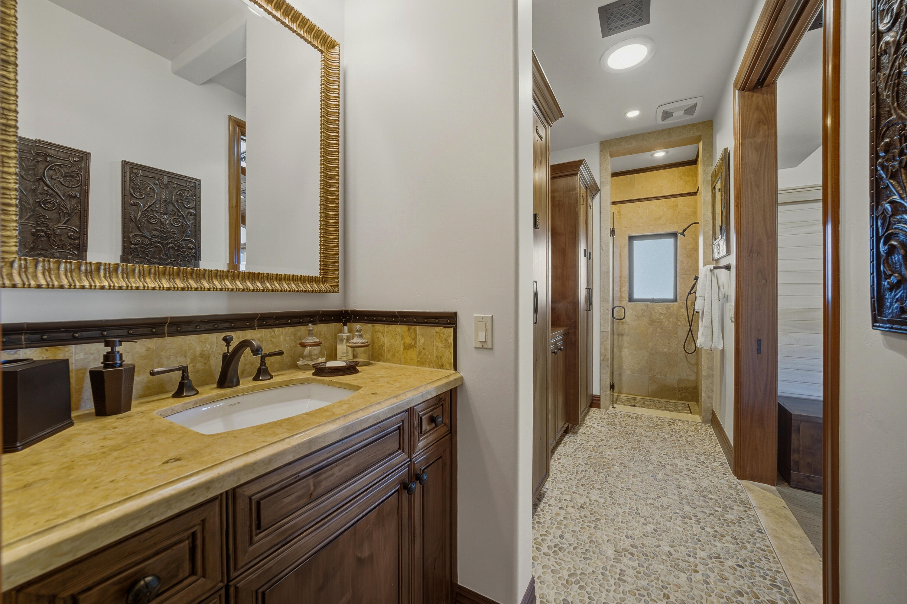 4 Via L' Antico Rancho Mirage, CA 92270 - Photo 56 of 75 a bathroom with a sink a vanity and a mirror