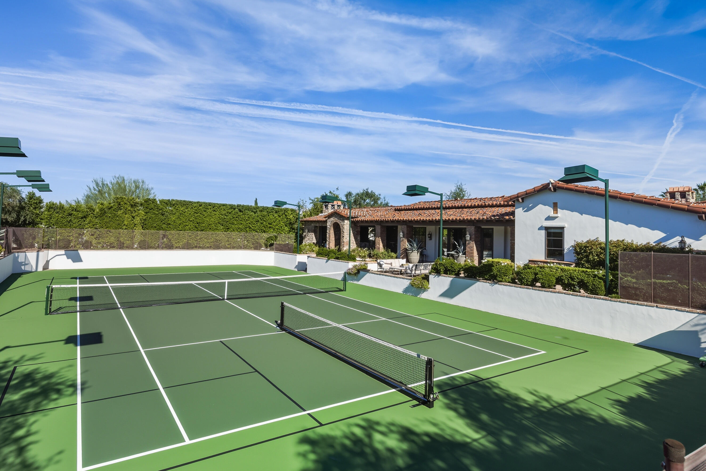 4 Via L' Antico Rancho Mirage, CA 92270 - Photo 63 of 75 a view of a tennis ground with large trees