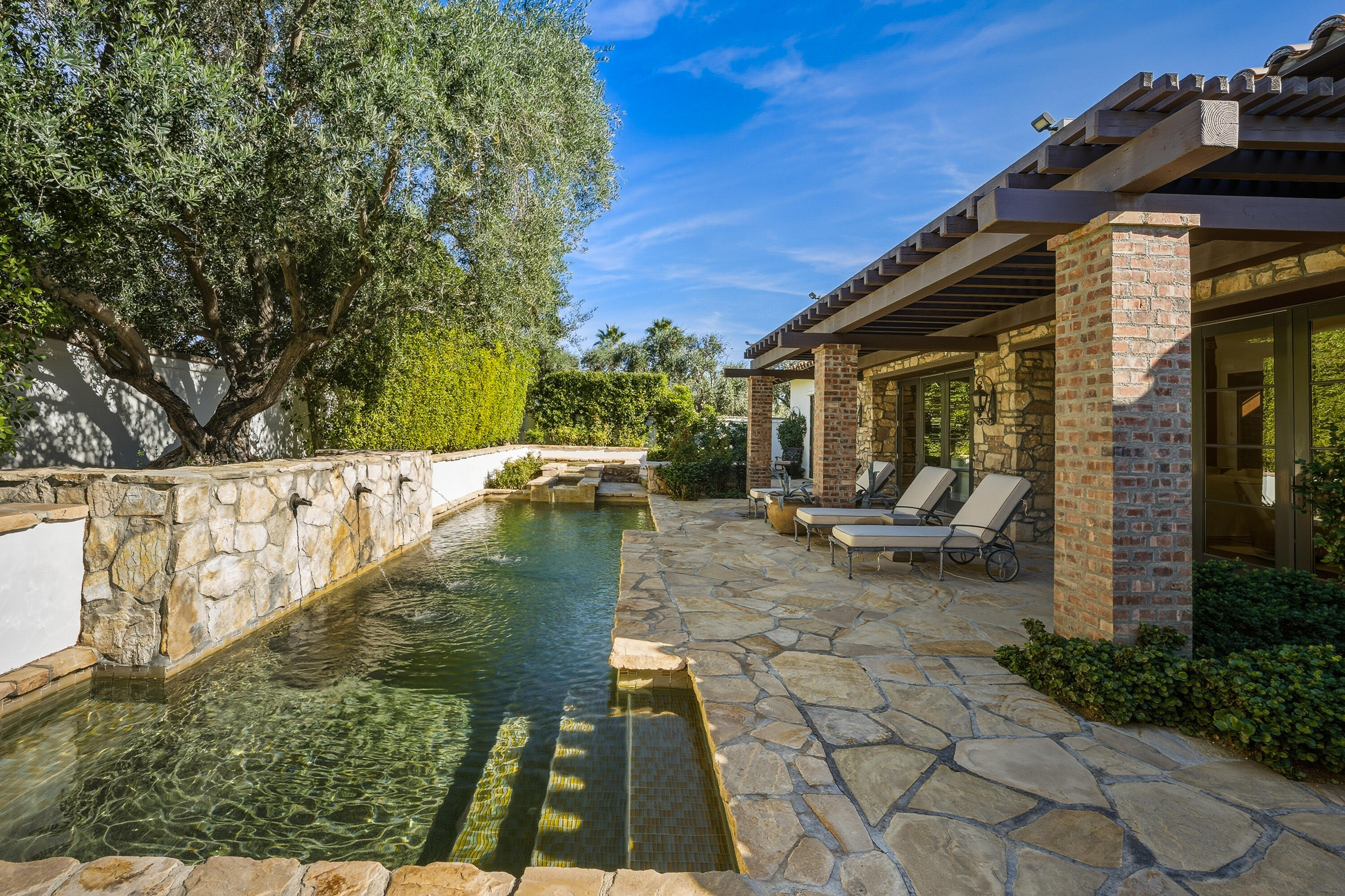 4 Via L' Antico Rancho Mirage, CA 92270 - Photo 67 of 75 a backyard of a house with lots of green space