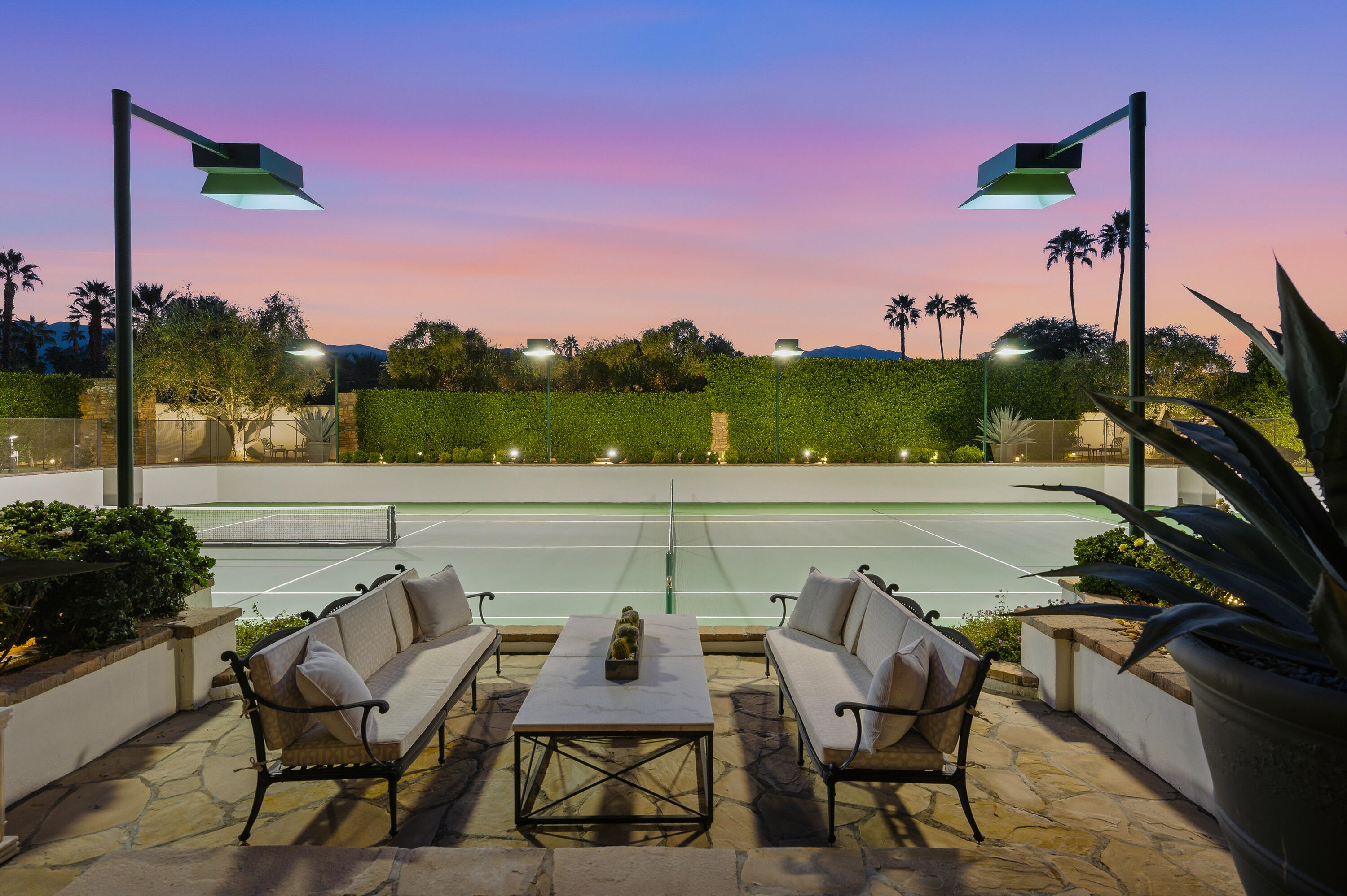 4 Via L' Antico Rancho Mirage, CA 92270 - Photo 10 of 75 a view of a terrace with furniture and a potted plant
