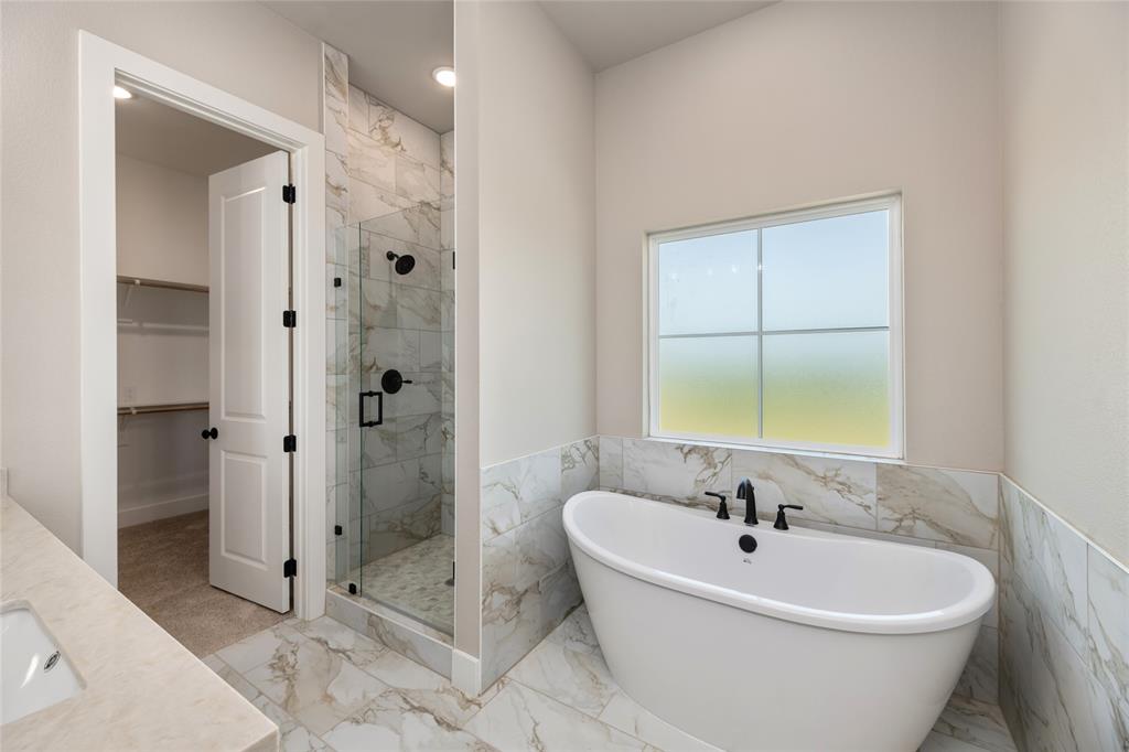 217 Fm 2258 Venus, TX 76084 - Photo 22 of 36 a white bath tub sitting next to a bathroom sink
