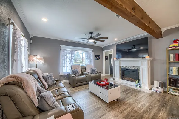 a living room with furniture window and a fireplace